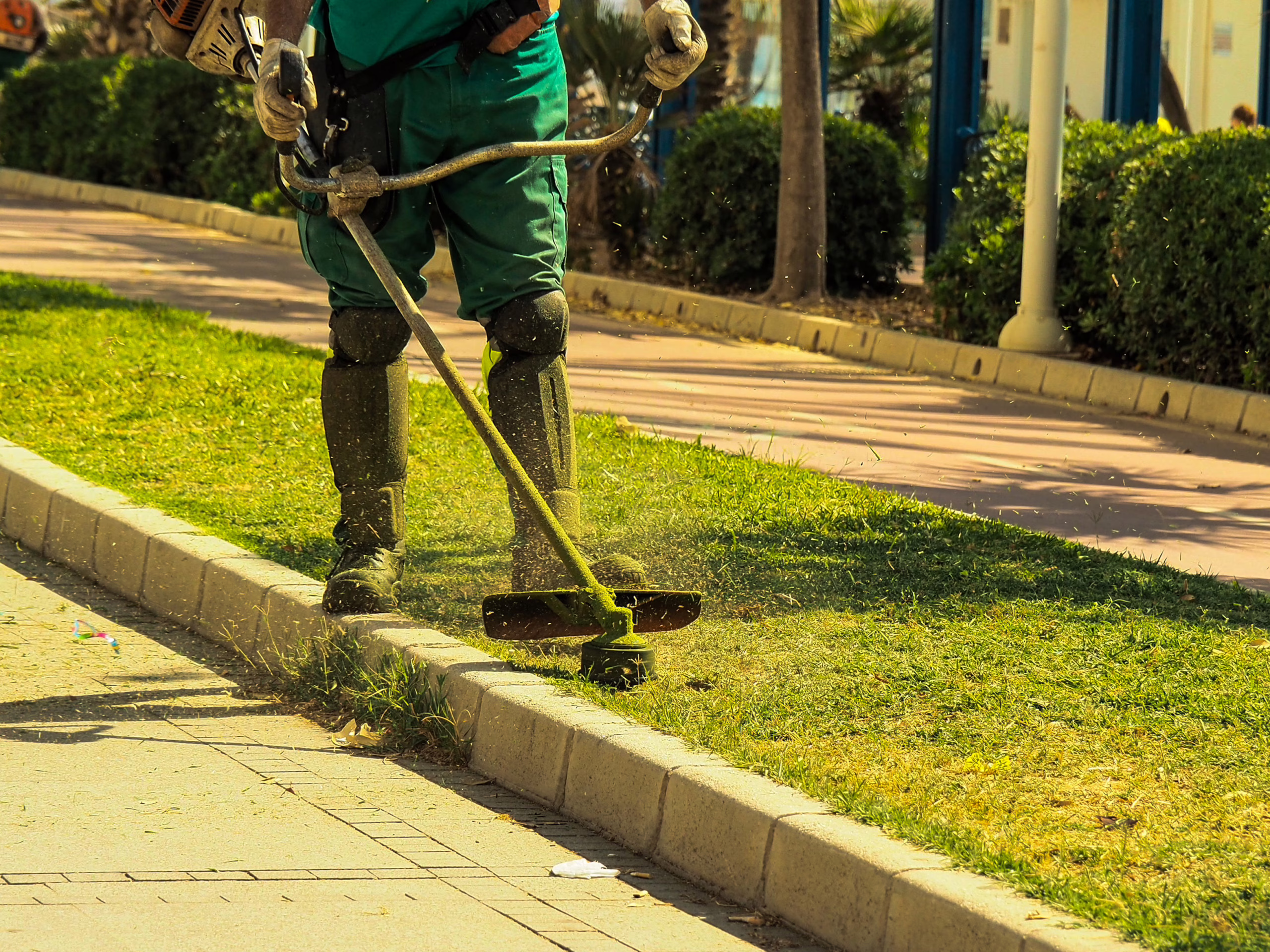 Gardener working with a lawnmower