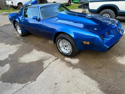 Classic blue sports car with sleek design, perfect for car enthusiasts and collectors.
