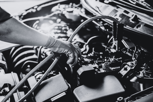 Professional tire service being performed on a vehicle engine.