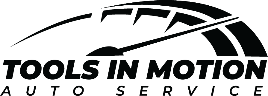 Tools in Motion auto repair shop performing vehicle diagnostics and maintenance.