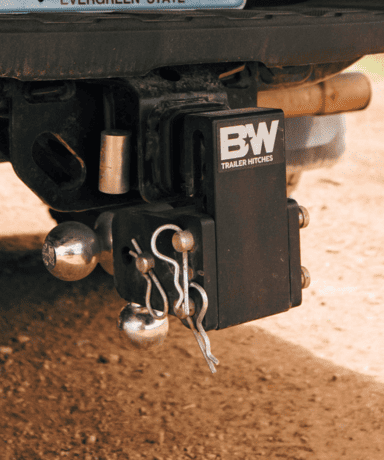Heavy-duty trailer hitch with BW logo, ideal for towing and vehicle customization.