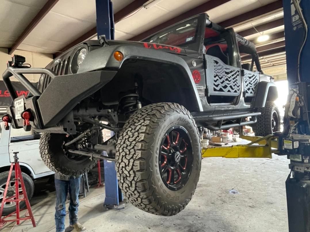 Custom Jeep with lifted suspension and off-road tires at Trendsetters Customs.
