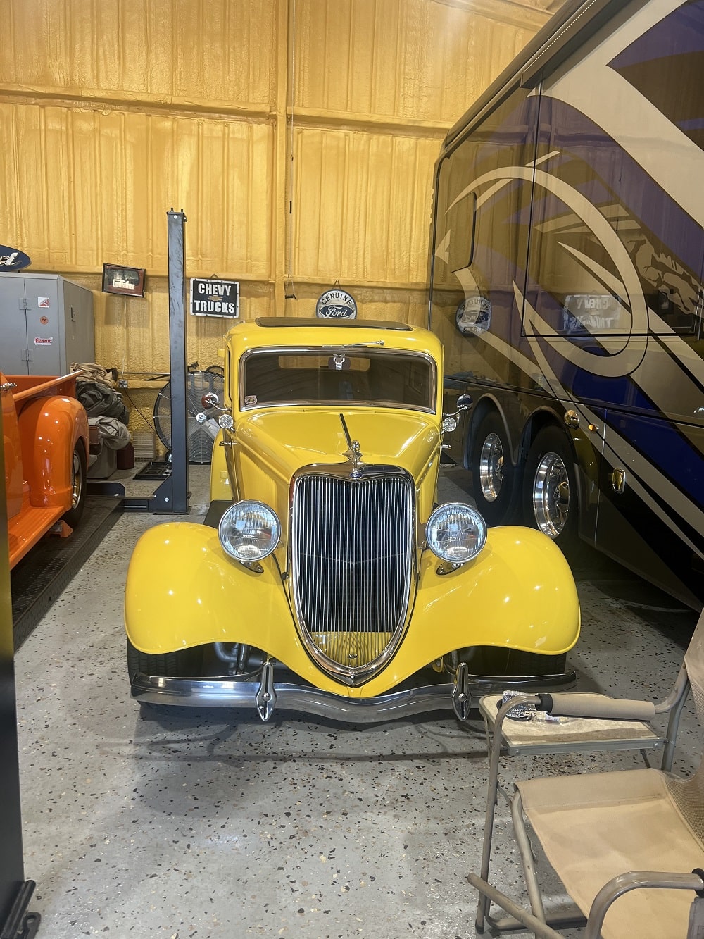 Vintage yellow classic car with restored details at Trendsetters Customs.