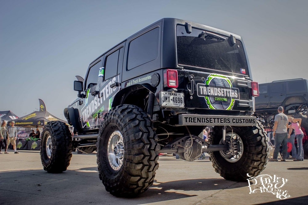 Custom off-road Jeep with oversized tires and custom graphics by Trendsetters Customs.