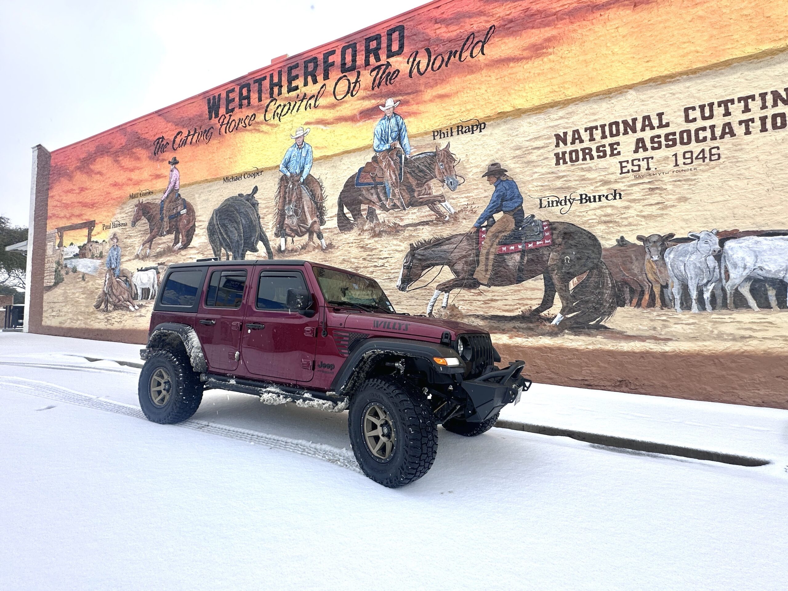 Weatherford mural of Western heritage with a Jeep Wrangler in front, highlighting local history and.