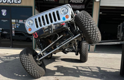 Custom Jeep with lifted suspension and off-road tires at Trendsetters Customs.
