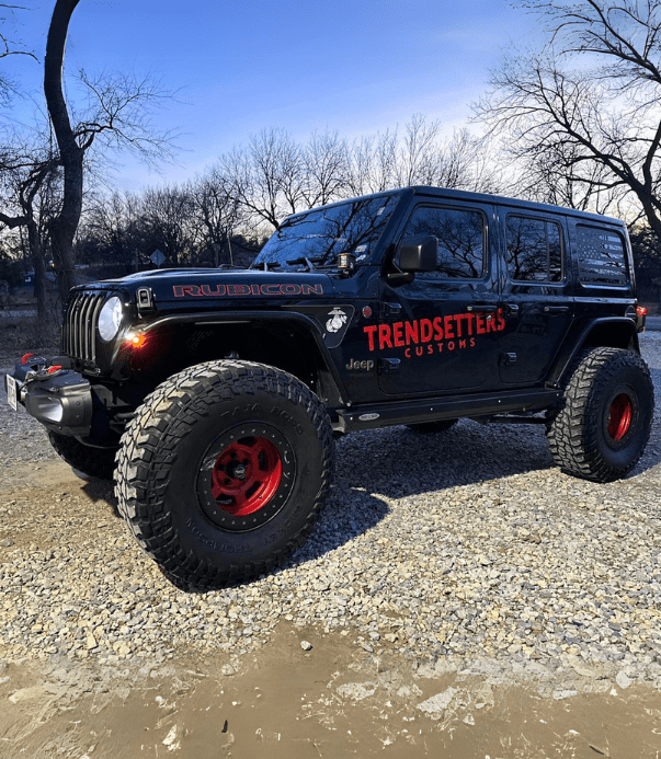Custom-wrapped Jeep Wrangler by Trendsetters Customs for off-road adventures.