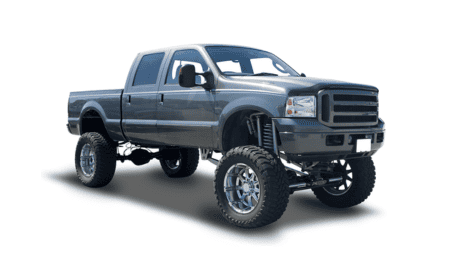 Custom lifted off-road truck with large tires and upgraded suspension.