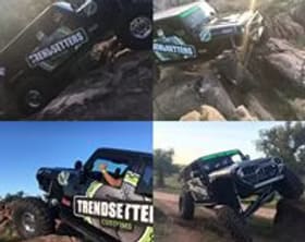 Custom Jeep off-road vehicle with rugged modifications and branding.