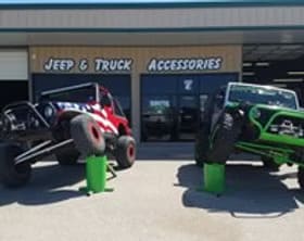 High-quality Jeep and truck accessories showcased outside Trendsetters Customs store. Perfect for of.