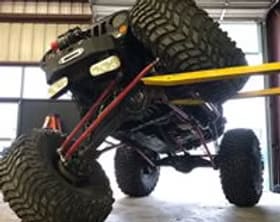 Custom off-road truck with large tires and lifted suspension by Trendsetters Customs.