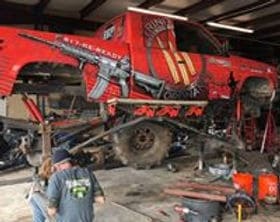 Custom off-road vehicle with custom paint and graphics by Trendsetters Customs.