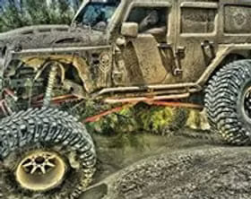 Custom off-road Jeep with upgraded tires and suspension.