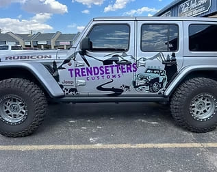 Custom Jeep wrap featuring Trendsetters Customs branding and vehicle graphics.