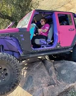 Jeep customized by Trendsetters Customs with vibrant colors and off-road enhancements.