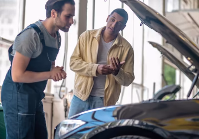 mechanic explaining car issues to a customer