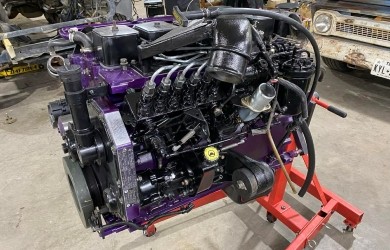 High-performance custom car engine with purple accents and advanced components.