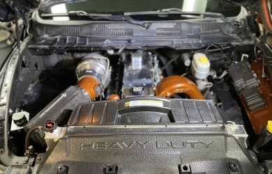 Custom car engine with turbochargers and performance modifications.