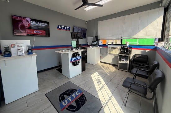 Inside view of Universal Tire Tire Center with service counters and seating area.