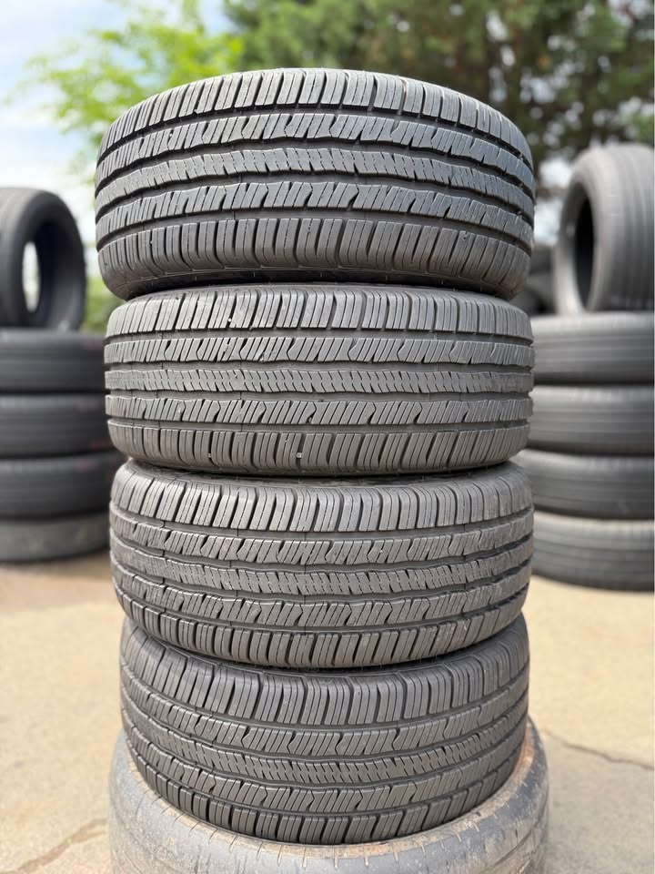 Stacked used tires at Universal Tire Tire Center for sale.