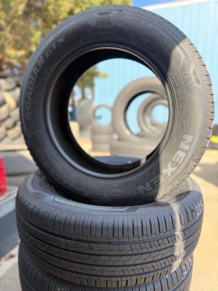 Stacked used Nexen tires at Universal Tire Tire Center for sale.