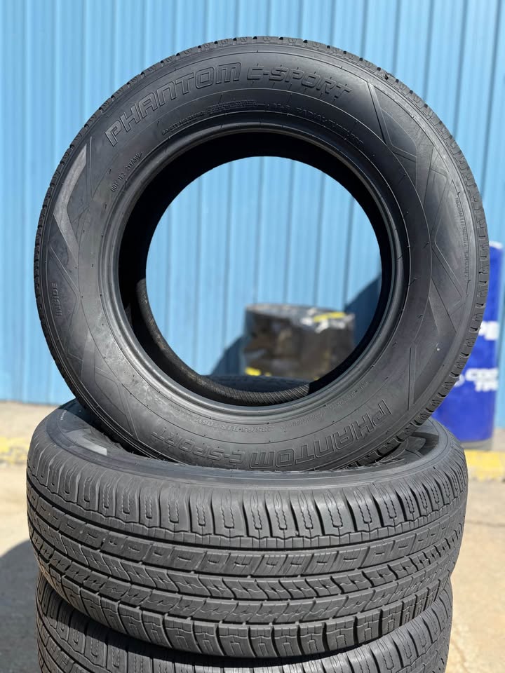 Stacked used tires for sale at Universal Tire Tire Center.