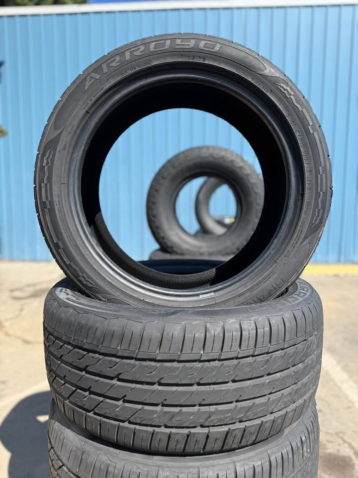 Stack of used tires for sale at Universal Tire Tire Center.
