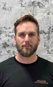Automotive technician working at Wallace Automotive.
