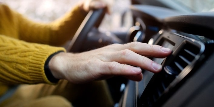 Car dashboard with controls and steering wheel, emphasizing auto repair services at Wallace Automoti.
