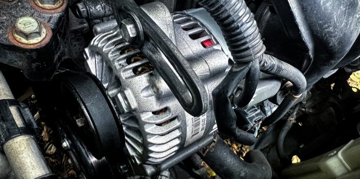 Engine alternator showing new and old components.