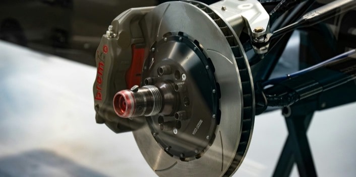 High-performance Brembo brake caliper and rotor for vehicle safety and stopping power.