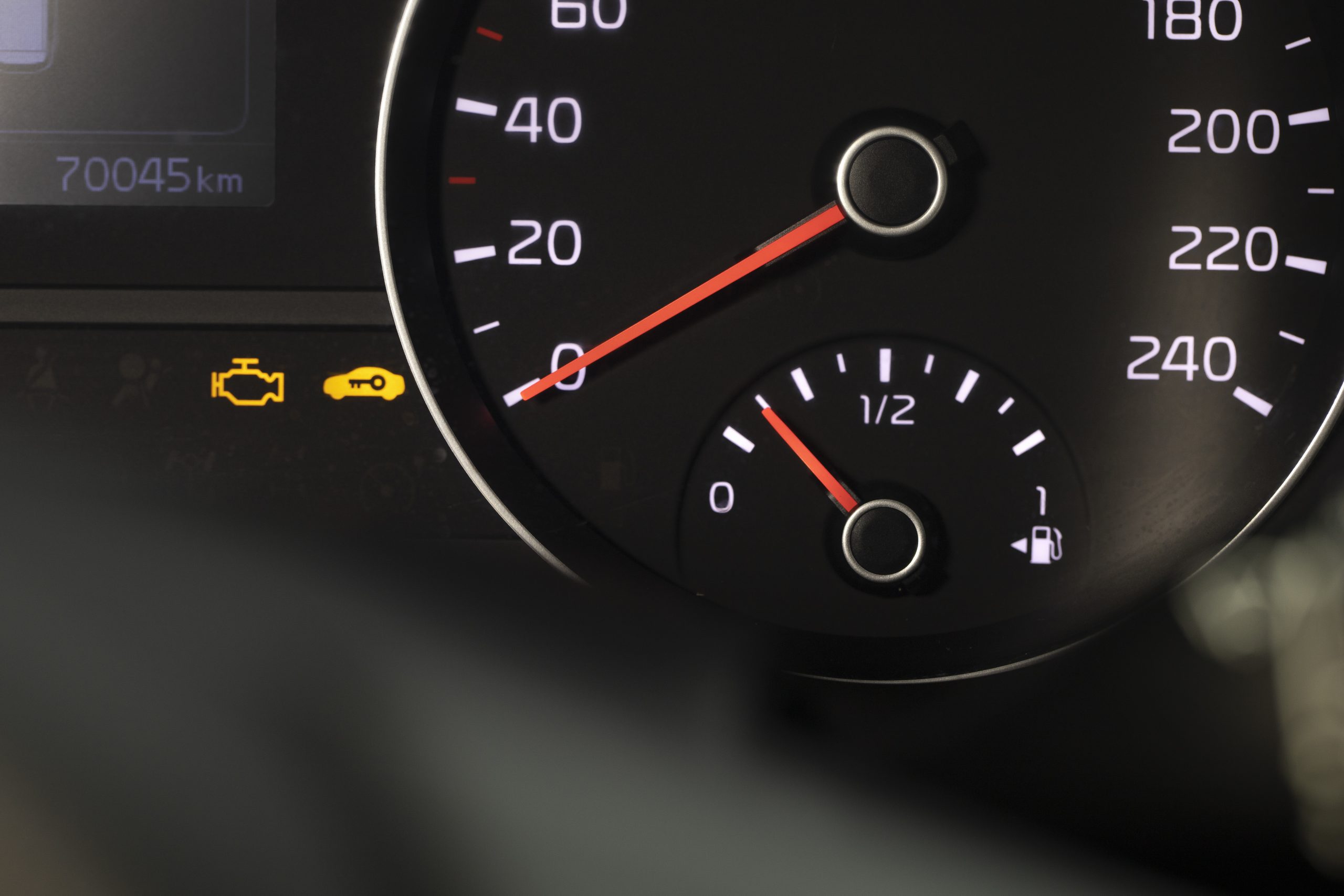 Oil pressure warning light illuminated on vehicle dashboard.