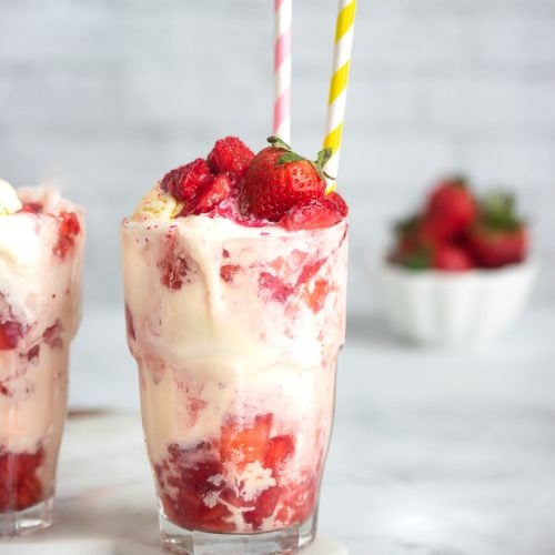 A strawberry float with macerated chopped strawberries, lime soda and vanilla ice cream topped with a strawberry