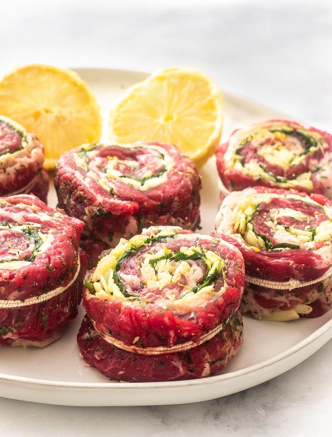 A plate of raw flank stuffed steak 