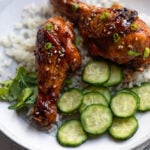 A plate of teriyaki chicken legs