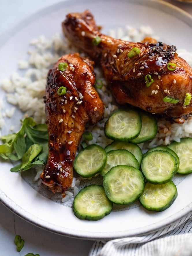 A plate of teriyaki chicken legs
