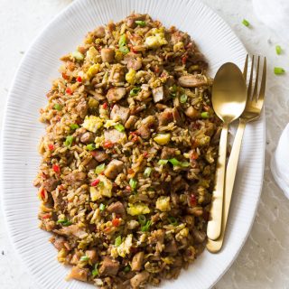 Arroz Chaufa is Peruvian's version of Chinese fried rice. It is influenced by the influx of Chinese immigrants to Peru. Peru's fried rice version consists of rice, sweet peppers, green onions, onions, garlic, soy sauce, scrambled eggs chicken and a dash of sesame oil, ginger and cumin. Amazingly delicious and you probably already have all the ingredients to make this!