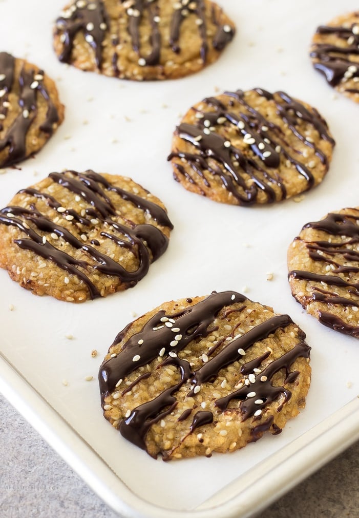 Benne or sesame seeds  were brought to America by West African slaves. They were commonly used to enhance the flavors of foods or used as a thickening agent.  African slaves believed the seeds to be good luck. Benne wafers are a staple dessert for many people in South Carolina and they are often served during Kwanzaa as well. Melt in your mouth, crisp, chewy, nutty and caramelized benne or sesame wafer/cookies are perfect for the holidays. For a more traditional type cookie, leave them plain or make them festive by drizzling them with chocolate sauce. Both ways are equally delicious.