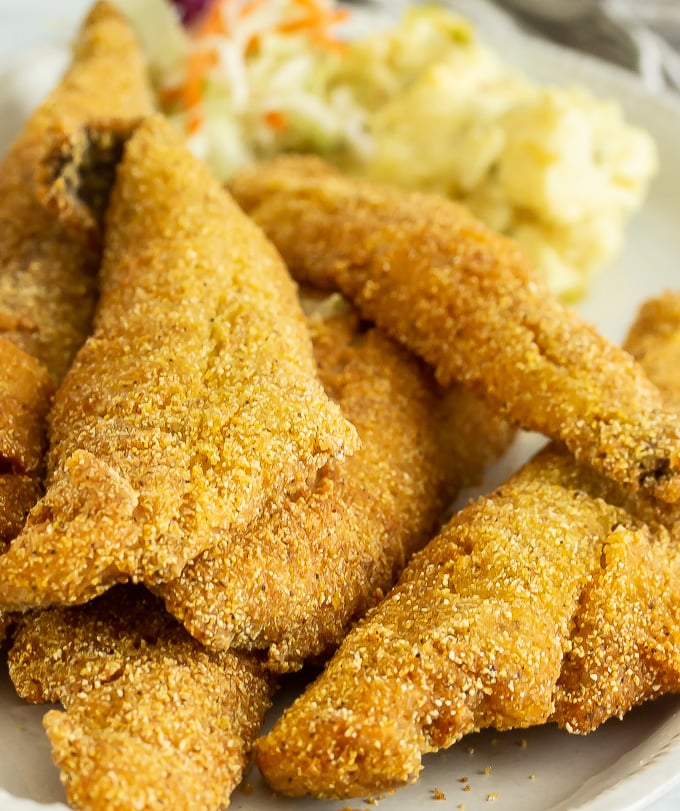 A plate of several pieces of fried whiting fish