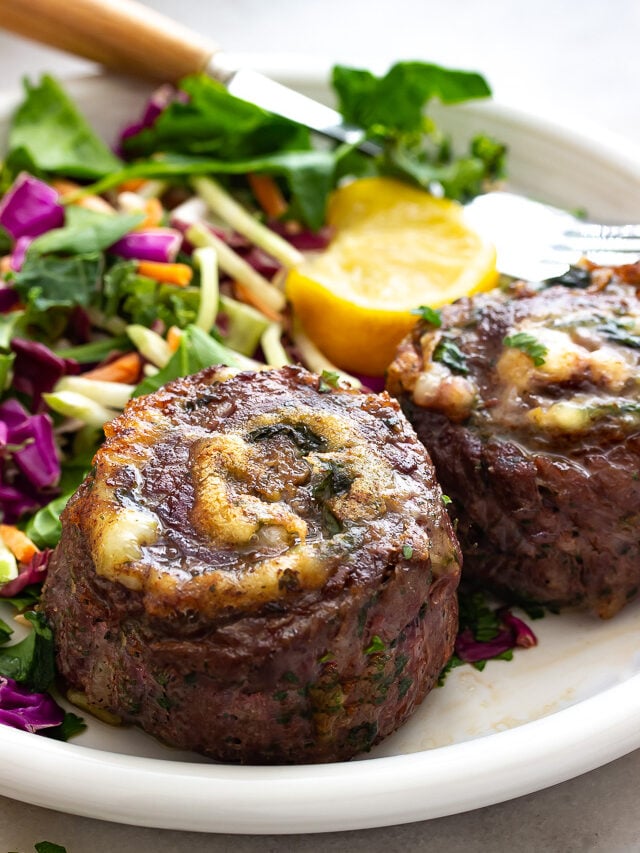 A plate of stuffed flank steak aka pinwheels