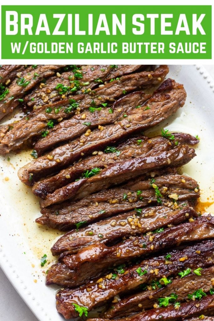 A plate of juicy tender Brazilian Steak with garlic butter drizzled on top
