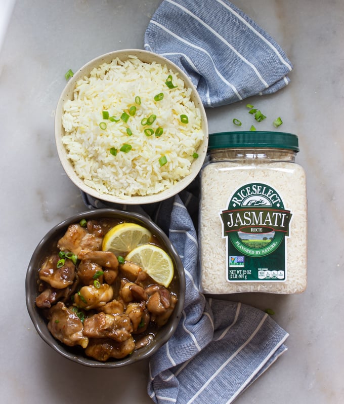 A picture of a bowl of RiceSelect Rice and a bowl of caramel chicken