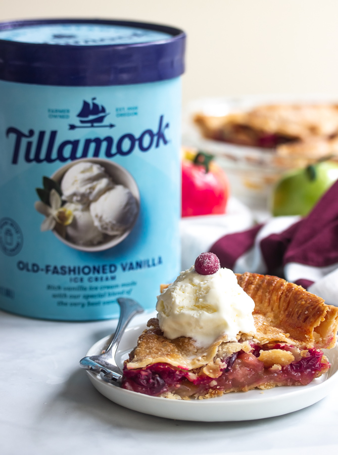 A picture of Tillamook old fashioned ice cream and a plate of cranberry apple pie topped with ice cream