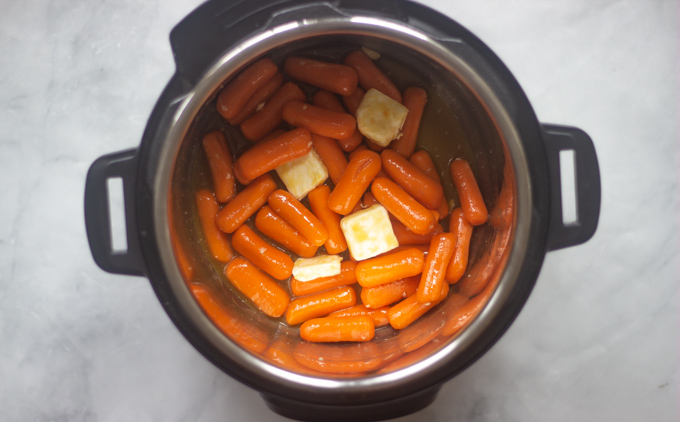 Instant pot with carrots, oj, butter and sugar