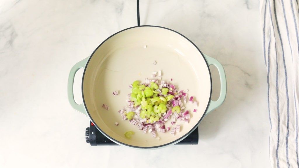 Sauteeing onions and celery in a large pot