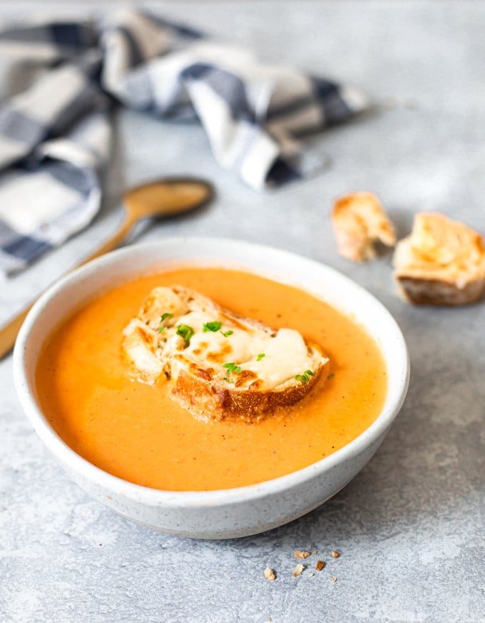 a bowl of tomato bisque soup 