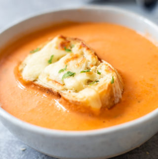 A small bowl of Cheesy Tomato Bisque