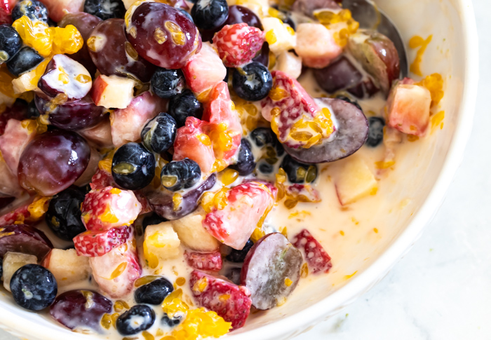 This picture of creamy fruit salad an example of why you don't use canned or frozen fruit. A hot soggy mess! 