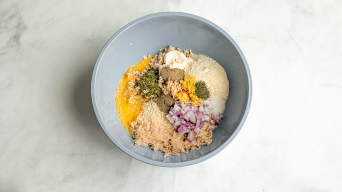 A bowl with tuna patties ingredients