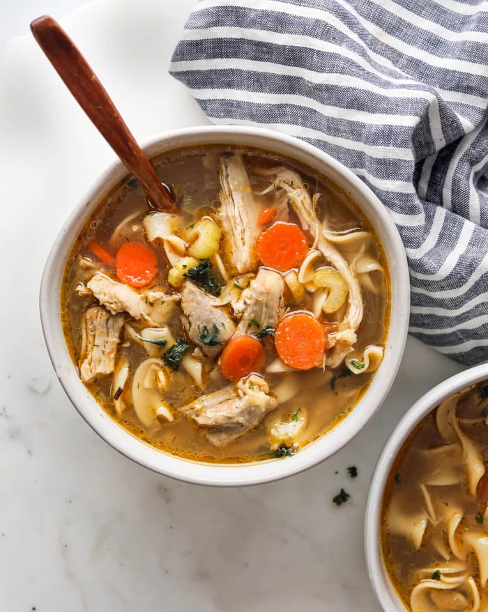 A picture of a bowl of homestyle chicken noodle soup